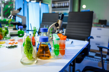 A detailed research concept in laboratory table setting, focused on food ingredients vegetables and meat. Test tubes, microscopes, lab equipment used to analyze nutritional extracts and vitamins.