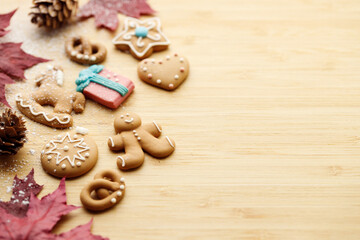 Christmas homemade gingerbread cookies on wooden table.