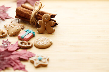 Christmas homemade gingerbread cookies on wooden table.