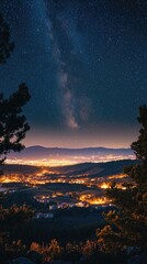 Naklejka premium A stunning night view of a starry sky over a glowing valley, highlighting the beauty of nature and the peacefulness of night.