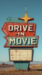 Vintage drive-in movie sign with classic star detail in daylight