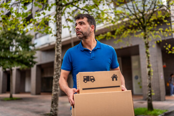 Confident delivery man with package on street