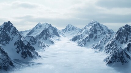 A vast, snow-covered mountain range with a clear blue sky in the background