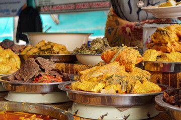 Variety of food in Indonesian market. Indonesian traditional food called Nasi Kapau with different type of menu