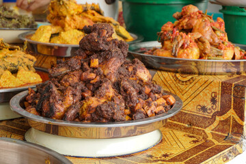 Variety of food in Indonesian market. Indonesian traditional food called Nasi Kapau with different type of menu