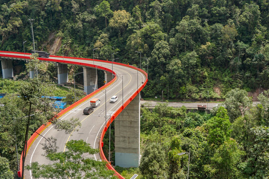 Car and truck passing by Famous winding road section called Kelok 9 located at East payakumbuh City in West Sumatera