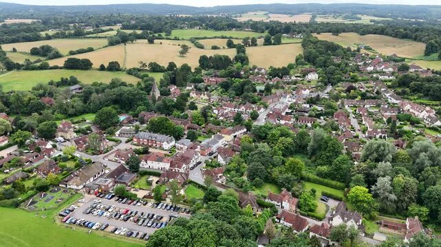 Panning drone aerial Shere Surrey UK quaint English Village