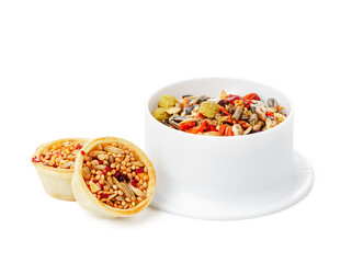 Nutritious seed mix served in a bowl with additional snacks for pet at home