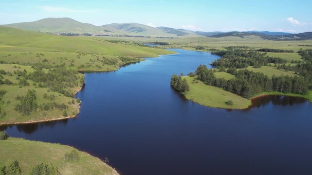 Drone Shot of Pristine Landscape, Alpine Lake, Green Meadows and Forest in Summer Season