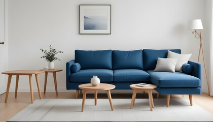 Modern blue sofa with wooden legs in a minimalist living room with a white wall and a wooden side table