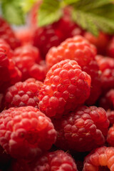 Ripe and juicy raspberry on the dark rustic background. Selective focus. Shallow depth of field.