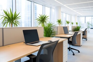 Fototapeta premium Empty Desks and Laptops in a Modern Office with Lush Greenery