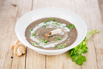 bowl of mushroom soup with cream and herbs. Perfect for healthy eating and comforting meals