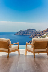 Relaxing view from a cozy terrace overlooking the blue waters of Santorini on a sunny day