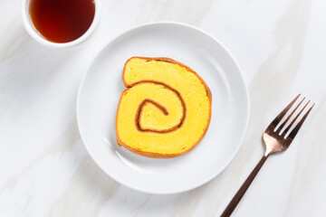 roll cake or Bolu Gulung pieces with cream. with copy space. perfect for recipe, article, catalogue, or any commercial purposes.