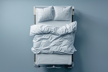 Cozy, rumpled bed with fresh white linens in a softly illuminated room during a tranquil morning