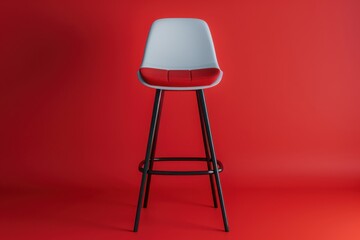 A modern bar stool stands elegantly against a vibrant red backdrop, showcasing its sleek design and minimalist aesthetic in a contemporary setting