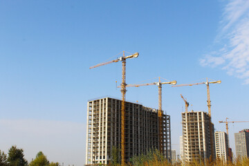 building under construction, construction site with cranes