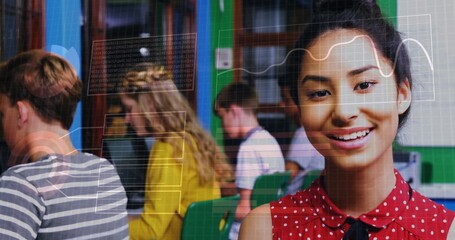 Binary code image over students studying in classroom