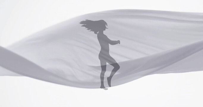 Image of silhouette of woman dancing and floating cloth on white background - Powered by Adobe
