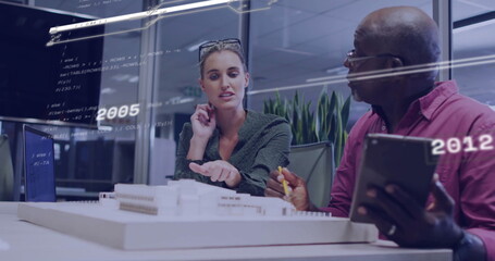 Image of data processing and diagrams over diverse colleagues discussing work