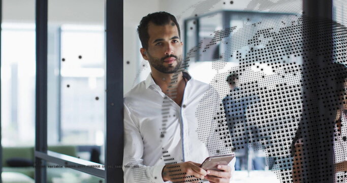 Image of globe and data processing over diverse business people in office