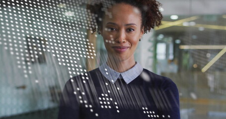 Image of financial data processing over biracial businesswoman in office