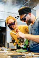 The Group of Happy Glassblowers Are Hard at Work on Their Latest Project in the Studio