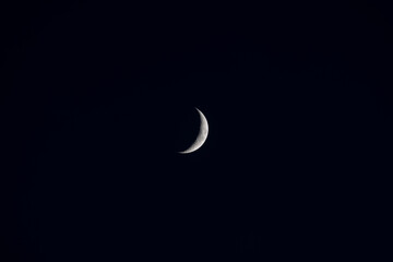 A new moon on a calm night with clear sky