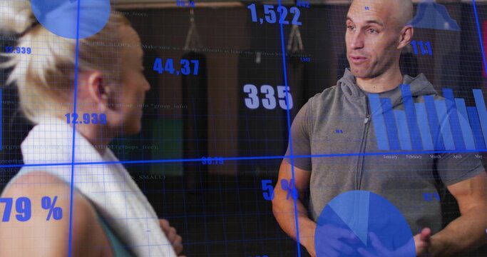 Image of financial data processing over caucasian couple talking on gym - Powered by Adobe