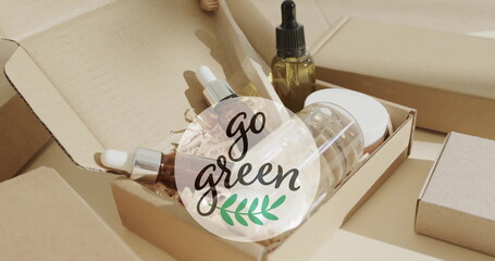 Image of go green text and leaf logo over organic beauty products in plain packaging