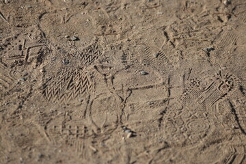  foot prints (shoe prints) on the sand