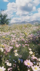 Fototapeta premium A vibrant field of wildflowers under a blue sky with clouds.