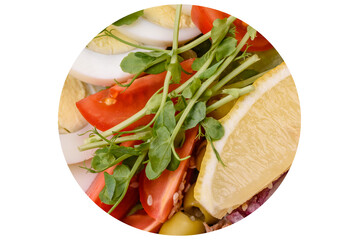 Salad with tuna pieces, boiled egg, cherry tomatoes, lettuce