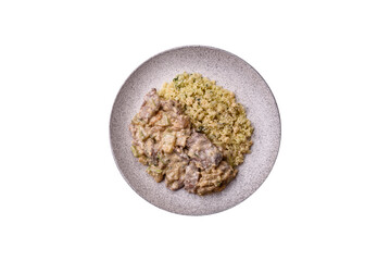 Bowl of food with beef, bulgur, tomatoes, zucchini and sauce