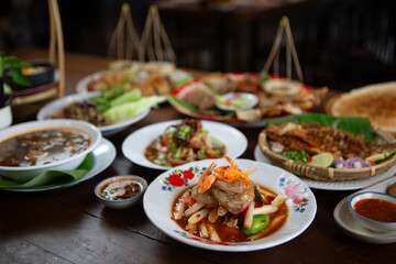 Set of Thai food, papaya salad or spicy salad somtum Thailand on the wooden table, thai spicy food