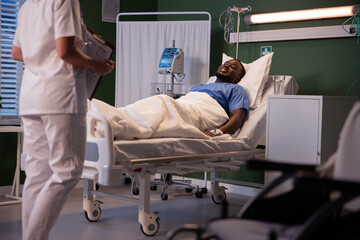 Physician, equipped with essential documents, arrives for a patient check-in.