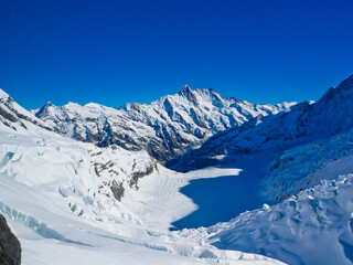 Alps Eiger and Jungfrau dramatic snowy mountain peaks panorama Switzerland.