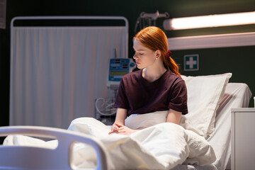 Red-haired patient receiving care and monitoring her health.