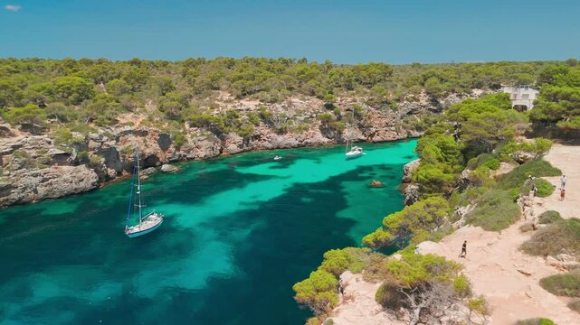 Aerial revealing view of the Bay of Cala Pi in Mallorca, Balearic Islands, Spain