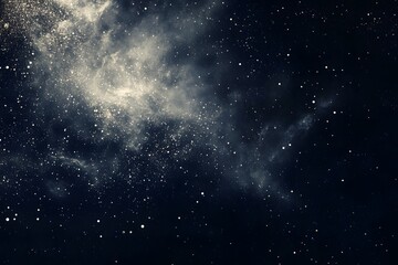 Obraz premium A cosmic scene filled with stars and nebula-like formations.