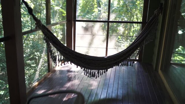 Terrace of a vacation rental room in the jungle with a Paraguayan hammock. Argentina.
