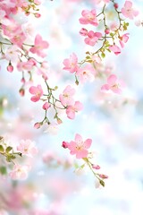 Delicate pink blossoms cascade gracefully against a soft, tranquil background, embodying the beauty of springtime in full bloom.