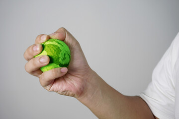 Male person hand holding green earth globe sphere ball, nature environment conservation concept