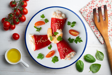 Red piquillo peppers stuffed with cod. Top view table with  decoration.