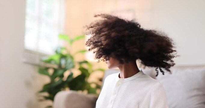 Hair care, portrait of african american girl smiling happy with her afro hair it home