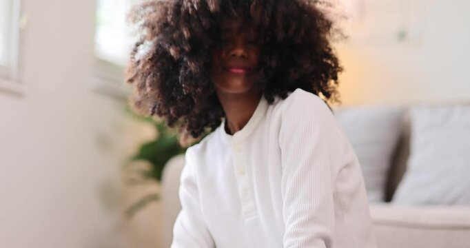 Hair care, portrait of african american girl smiling happy with her afro hair it home