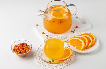 Sea buckthorn tea drink with oranges and mint. Autumn comfort hot drink. Herbal vitamin tea. 