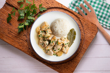 Garlic chicken with bay leaf aroma and white rice. Top view table with  decoration.