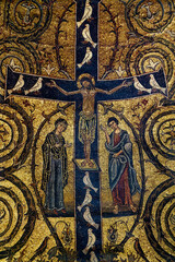 Mosaic of Jesus Christ crucified with doves on the cross represented with Marie and Saint..